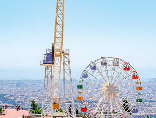 Tibidabo amusement park rides overlooking Barcelona, Spain.