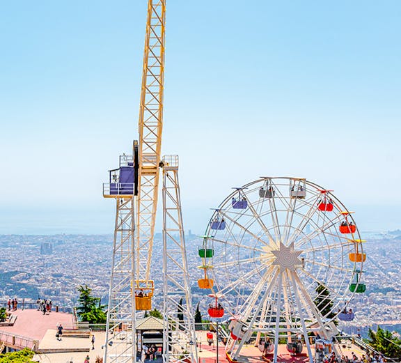 Tibidabo amusement park rides overlooking Barcelona, Spain.