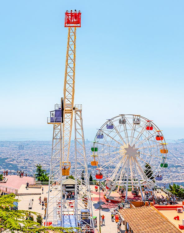 Tibidabo amusement park rides overlooking Barcelona, Spain.