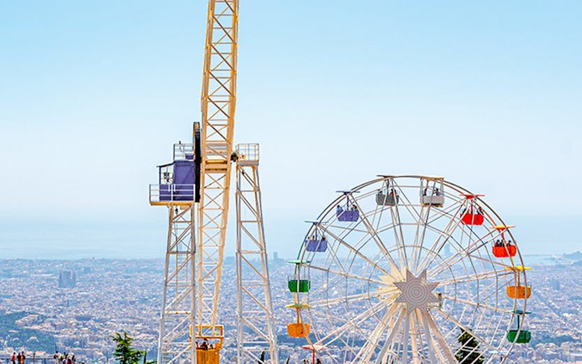 Tibidabo amusement park rides overlooking Barcelona, Spain.