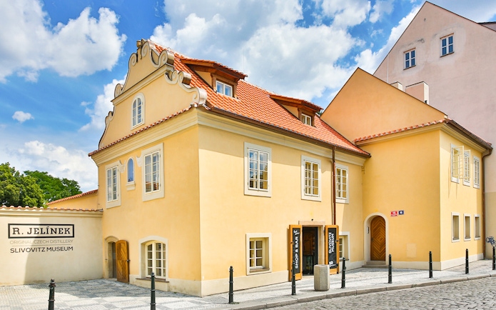 Slivovitz Museum entrance with signs for plum brandy tasting and 5D VR experience.