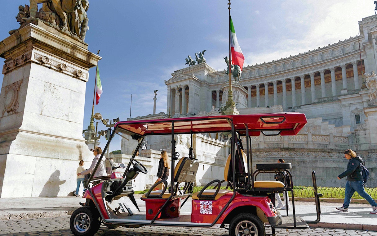 Golf cart near Altare della Patria in Rome during tour.