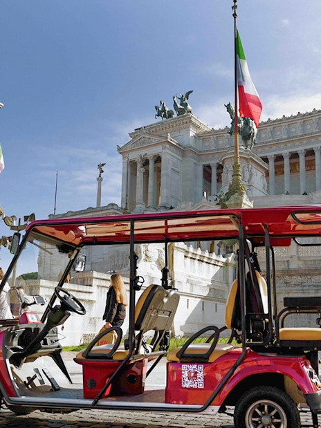 Golf cart near Altare della Patria in Rome during tour.
