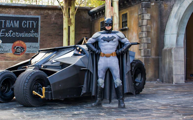 Batman standing with Batmobile at Parque Warner, Madrid.