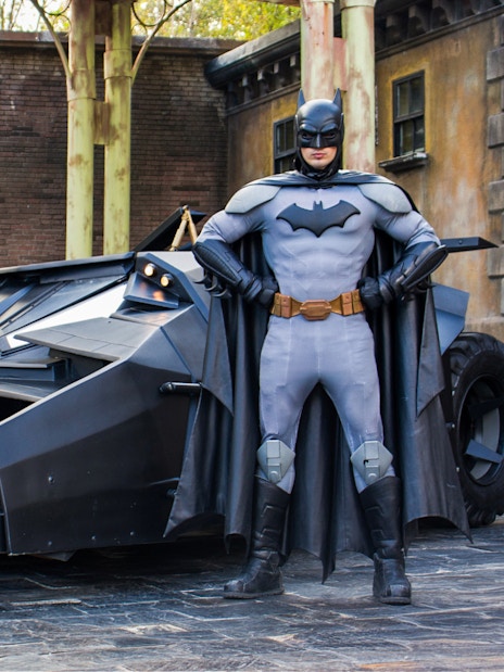 Batman standing with Batmobile at Parque Warner, Madrid.