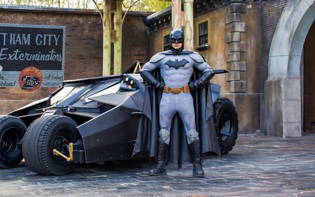 Batman standing with Batmobile at Parque Warner, Madrid.