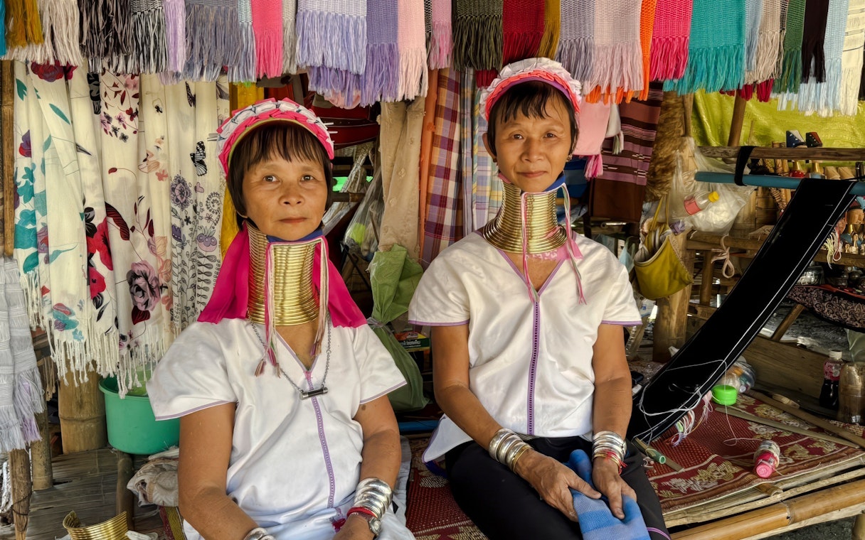 Women wearing traditional neck rings in Long Neck Village, Thailand.