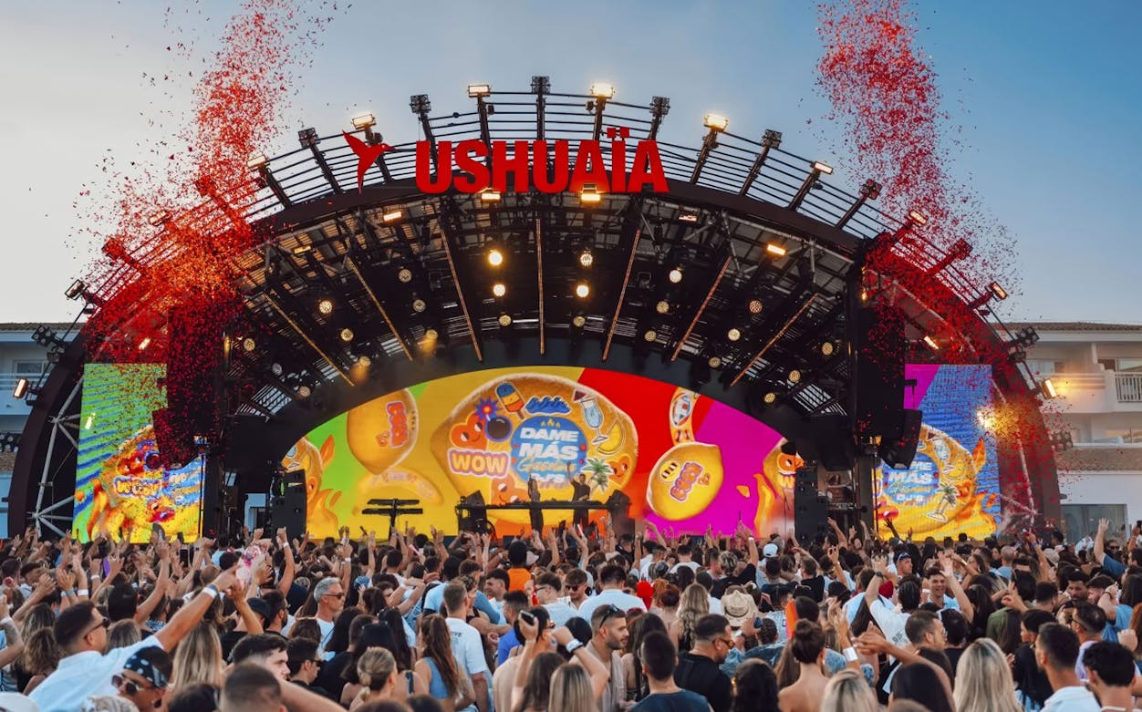 Crowd enjoying I Love Reggaeton performance at Ushuaïa Ibiza with vibrant stage visuals.