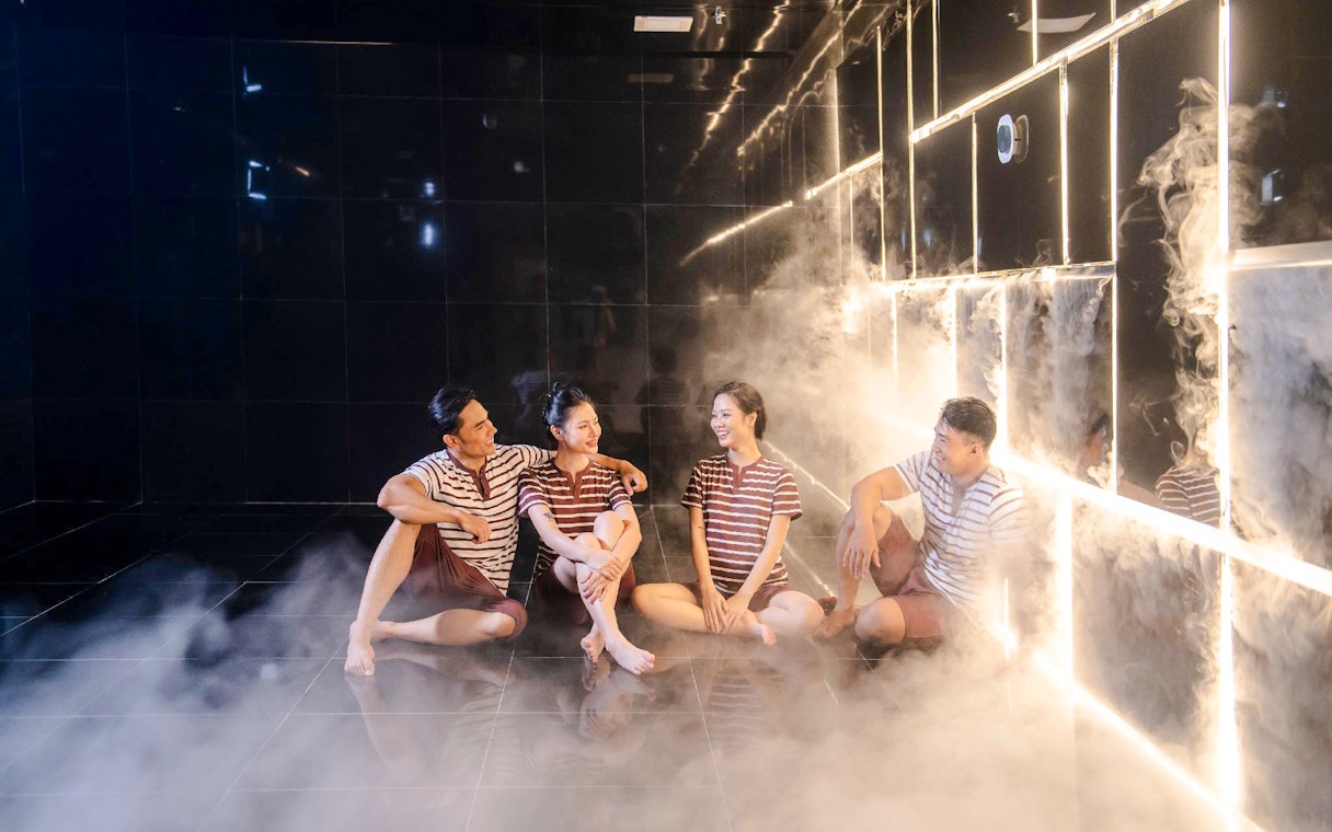 Group relaxing in steam room at Aquafield Nha Trang, Vietnam.