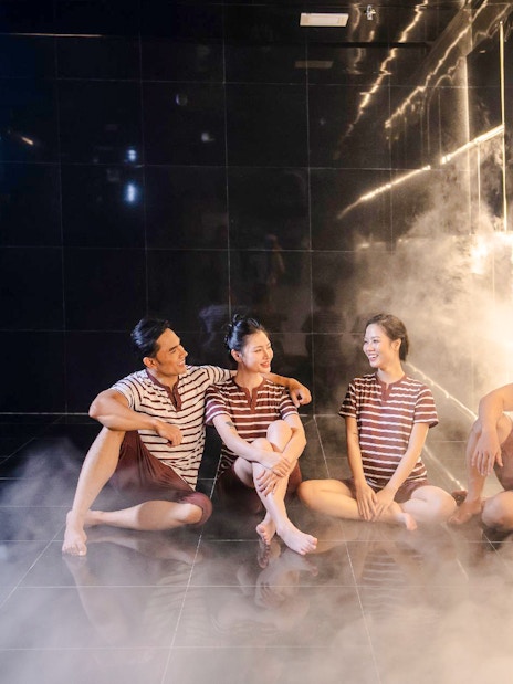 Group relaxing in steam room at Aquafield Nha Trang, Vietnam.