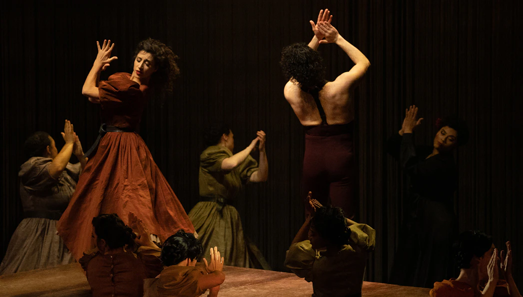 Performers in a dramatic dance scene from Ainadamar production.