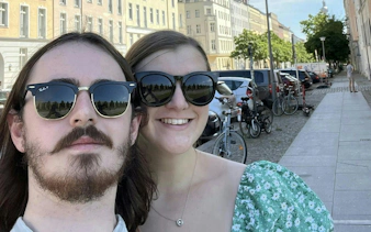Couple exploring Berlin street during self-guided spy mission game.