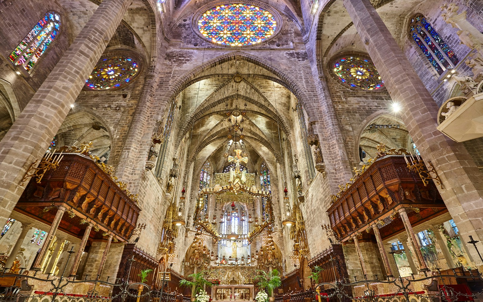Cathedral Museum interior with historical artifacts and stained glass windows, Florence, Italy.