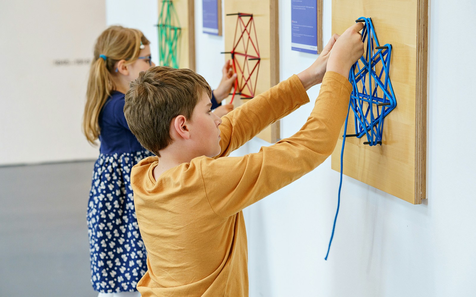 Children exploring interactive exhibits at a science museum