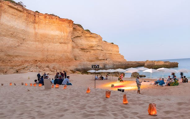 Beach gathering during Albufeira sunset cruise with barbeque dinner, Portugal.