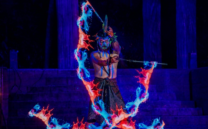 Performer with glowing fire effects at Sunway Lost World Hot Springs Night Park.