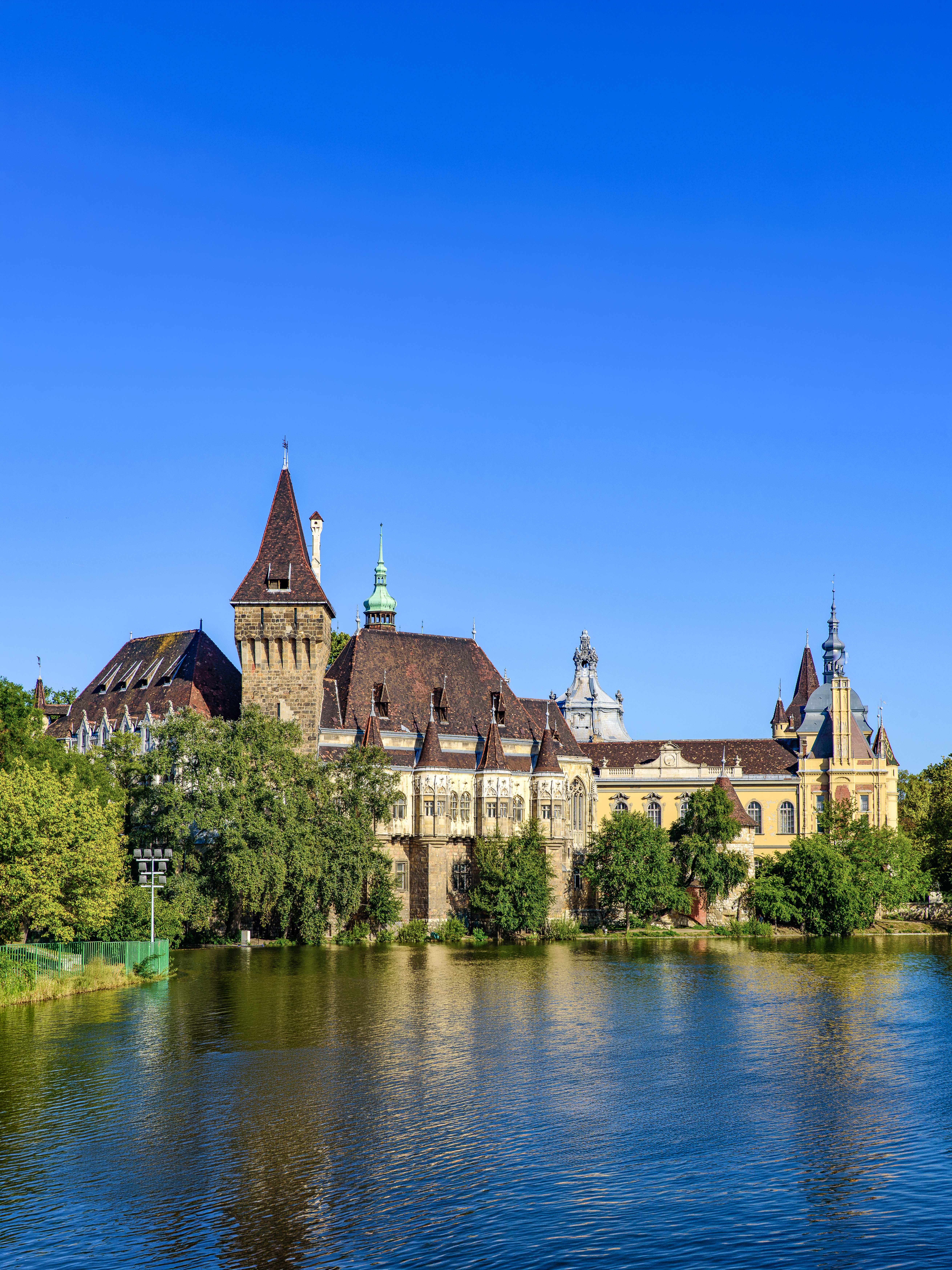 Vajdahunyad Castle reflected in a lake at City Park, Budapest, Hungary.