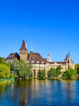 Vajdahunyad Castle reflected in a lake, City Park, Budapest, Hungary.