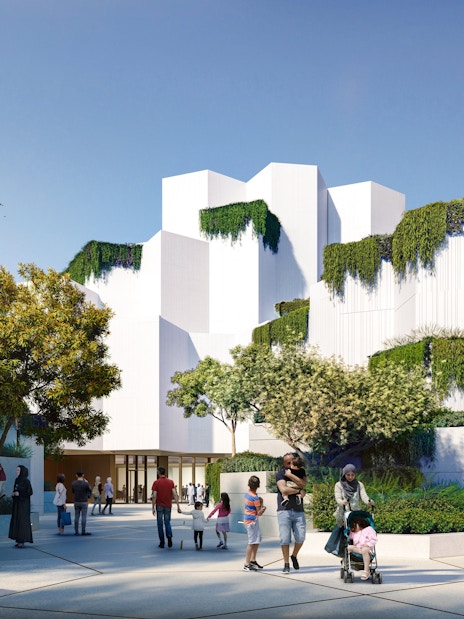 National History Museum Abu Dhabi exterior with visitors and greenery.