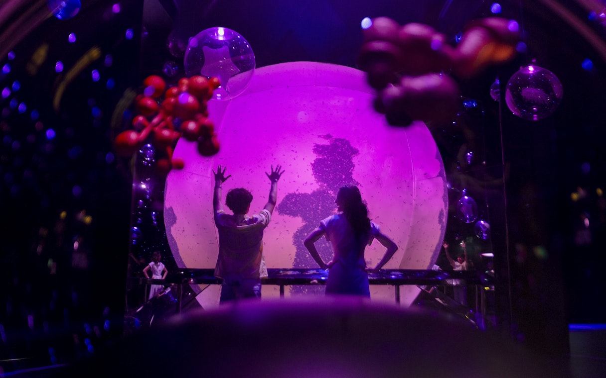 Interactive orb experience at Exploria, Mandai Wildlife, with visitors engaging in a light display.