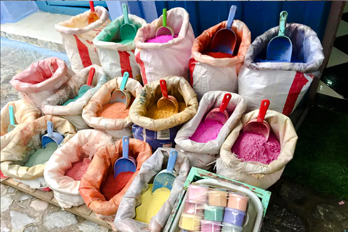 Colorful spice bags at a market in Amman, part of the Amman City Sightseeing Tour.