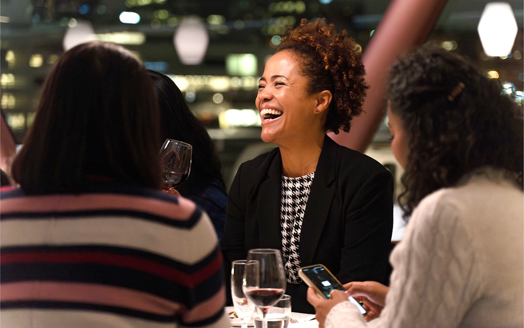 Guests enjoying a meal on an Oslo dinner cruise.
