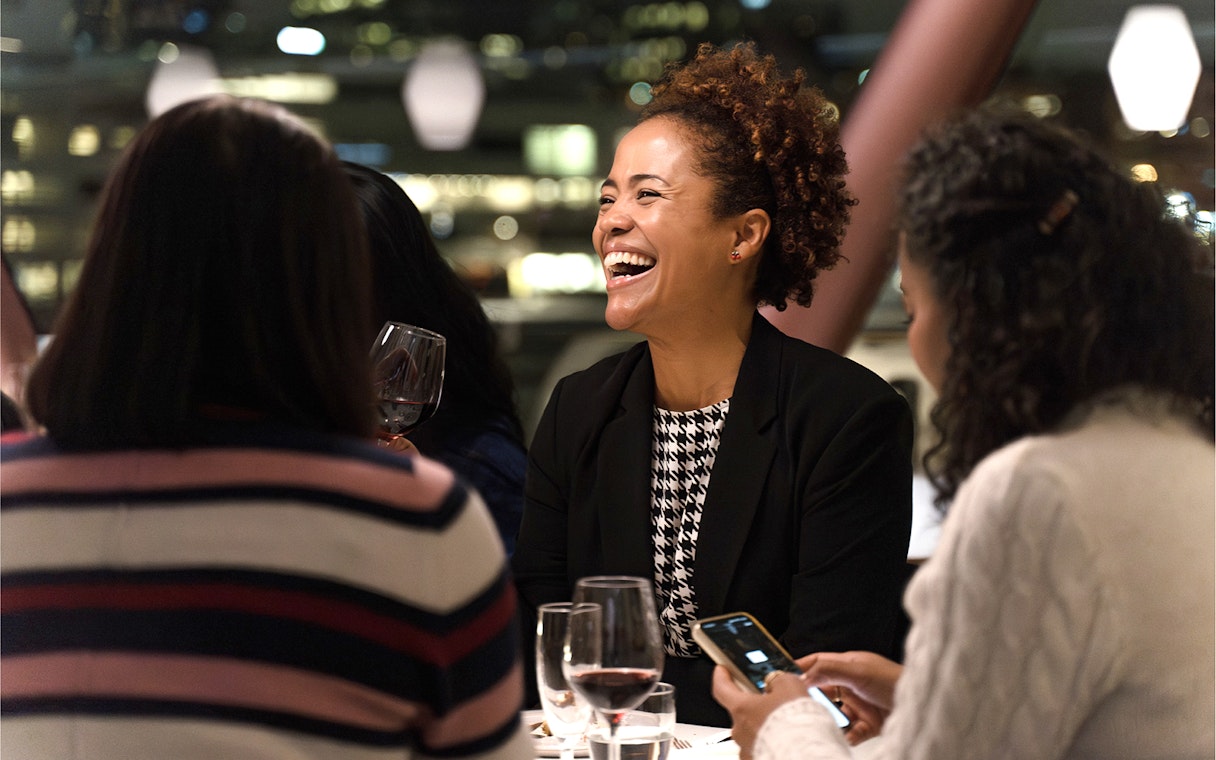Guests enjoying a meal on an Oslo dinner cruise.