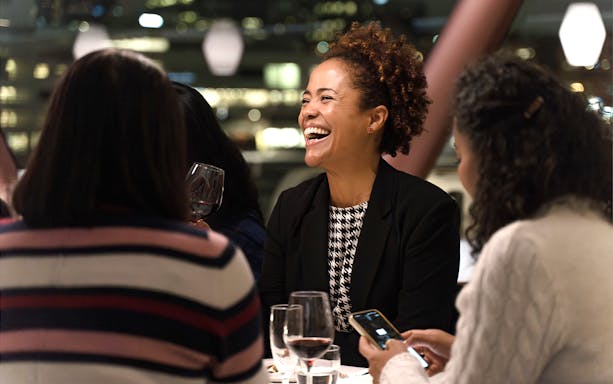 Guests enjoying a meal on an Oslo dinner cruise.