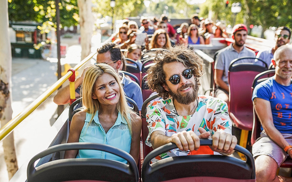 Visitors enjoying a ride on the Seattle Hop-On Hop-Off Bus.