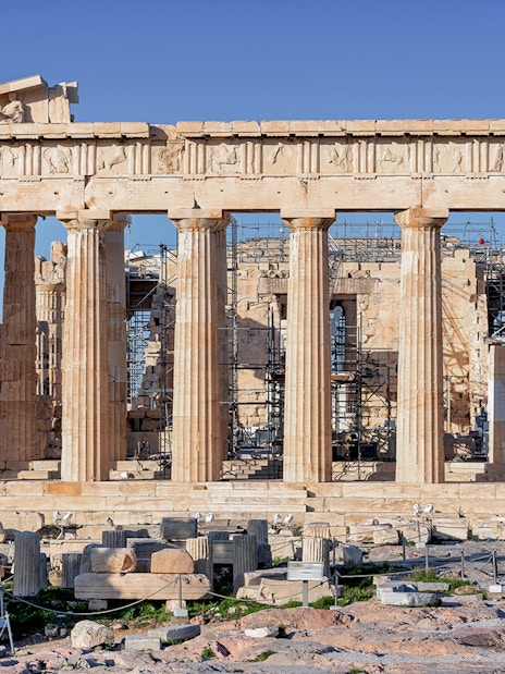 Parthenon Temple on Acropolis hill in Athens, Greece, with clear blue sky.