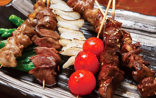 Skewers of grilled meat, vegetables, and seafood at Hakata Dojo Ueno, Tokyo.