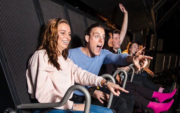 Tourists enjoying 5D ride at This Is Holland in Amsterdam.