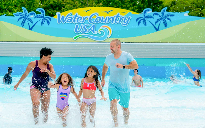 Families enjoying Surfer's Bay Wave Pool at Water Country USA.
