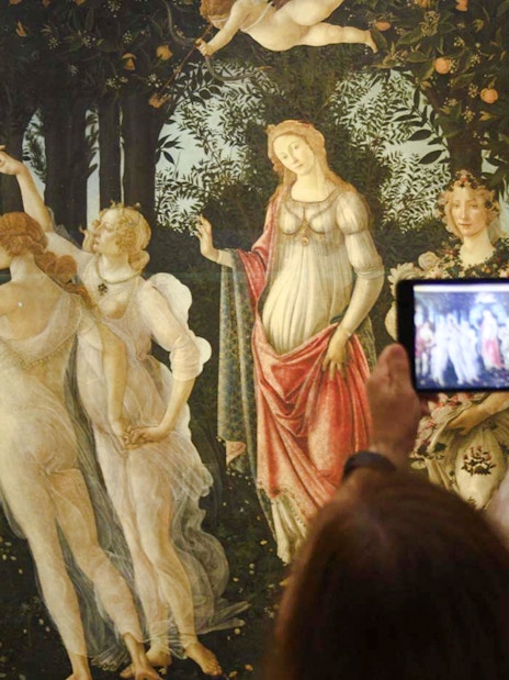 Visitors photographing Botticelli's "Primavera" at Uffizi Gallery during a private tour.
