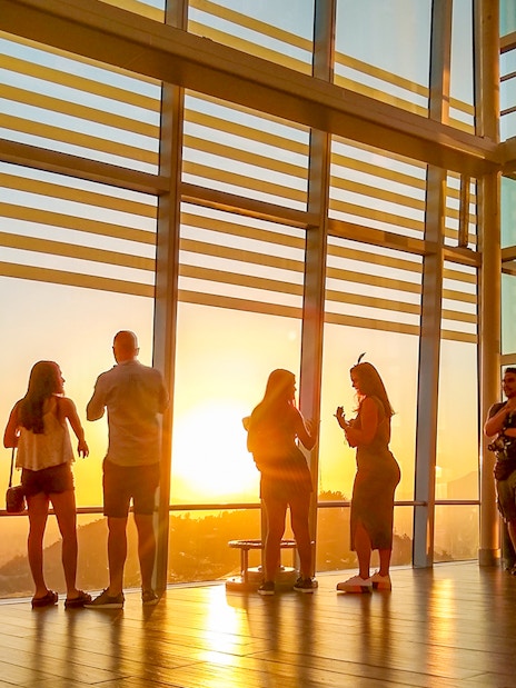 Visitors enjoying sunset views from Sky Costanera in Santiago, Chile.