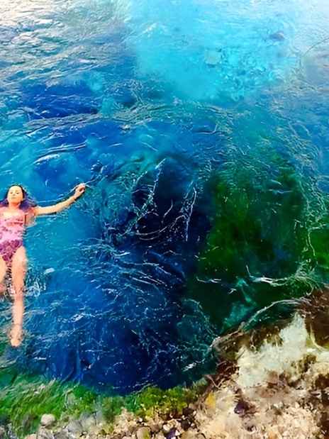 Guest swimming in the vibrant waters of the Blue Eye, Albania.