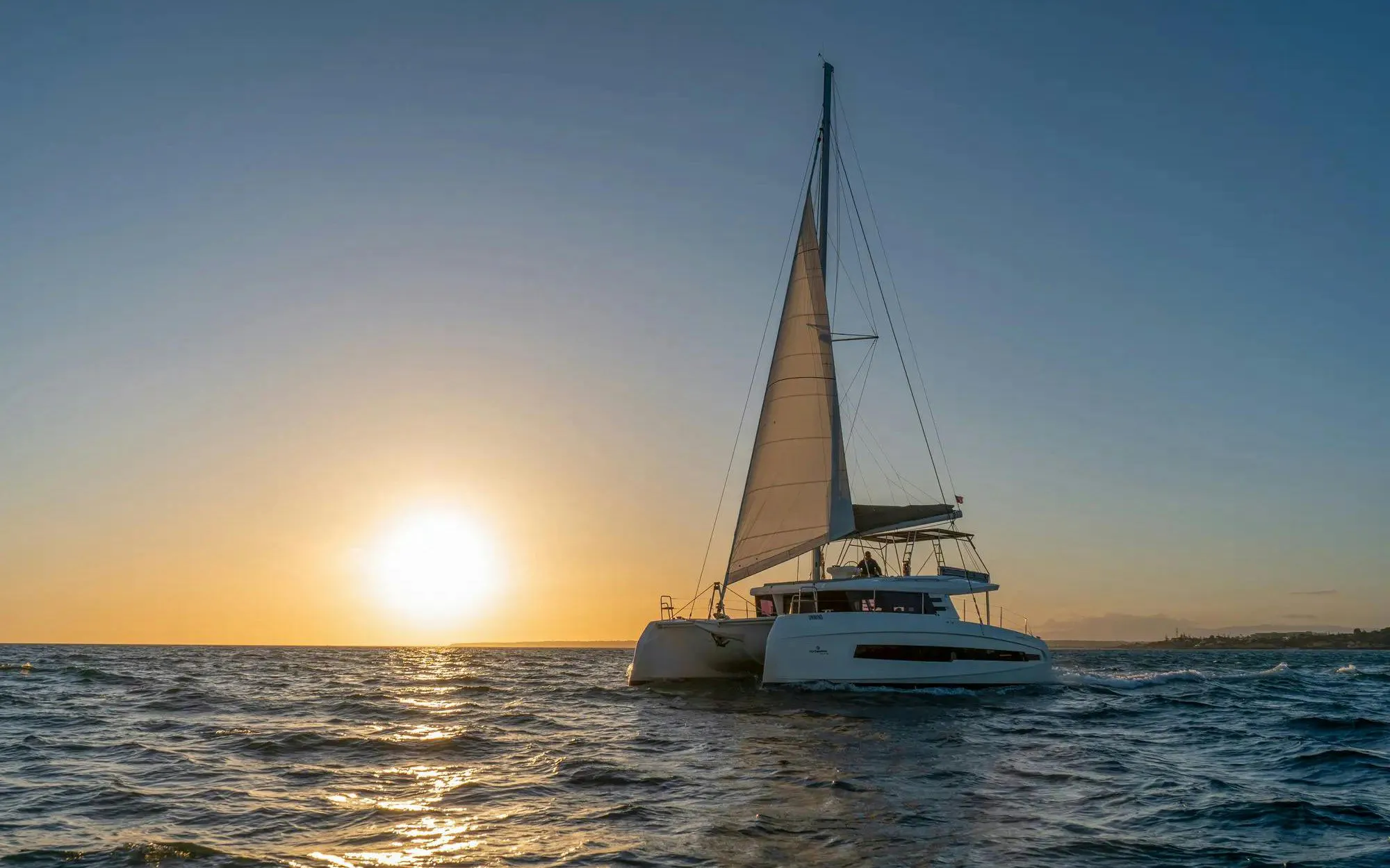 Catamaran sailing at sunset on Algarve tour from Vilamoura.