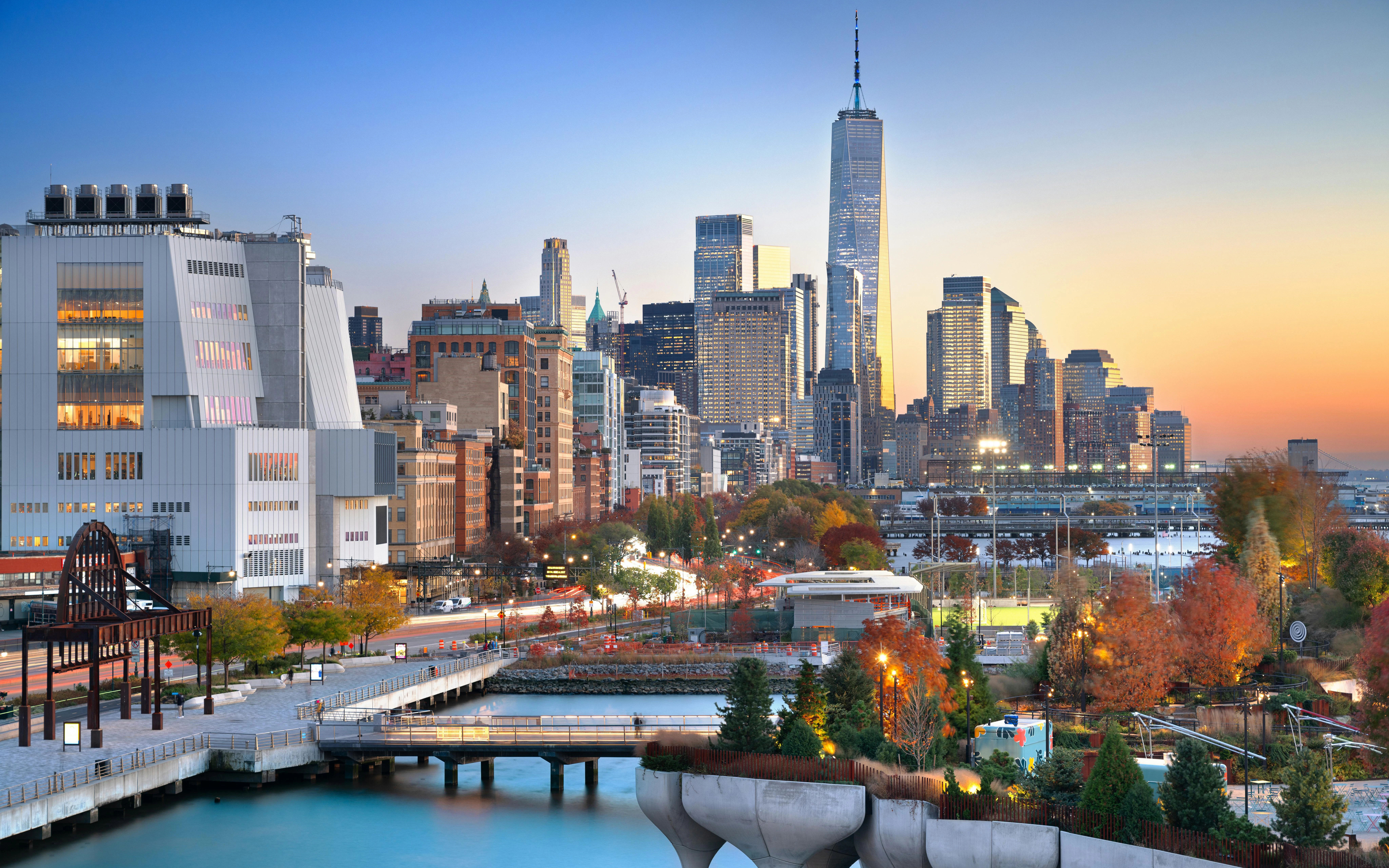 Lower Manhattan skyline at dusk with autumn foliage, view from Chelsea.