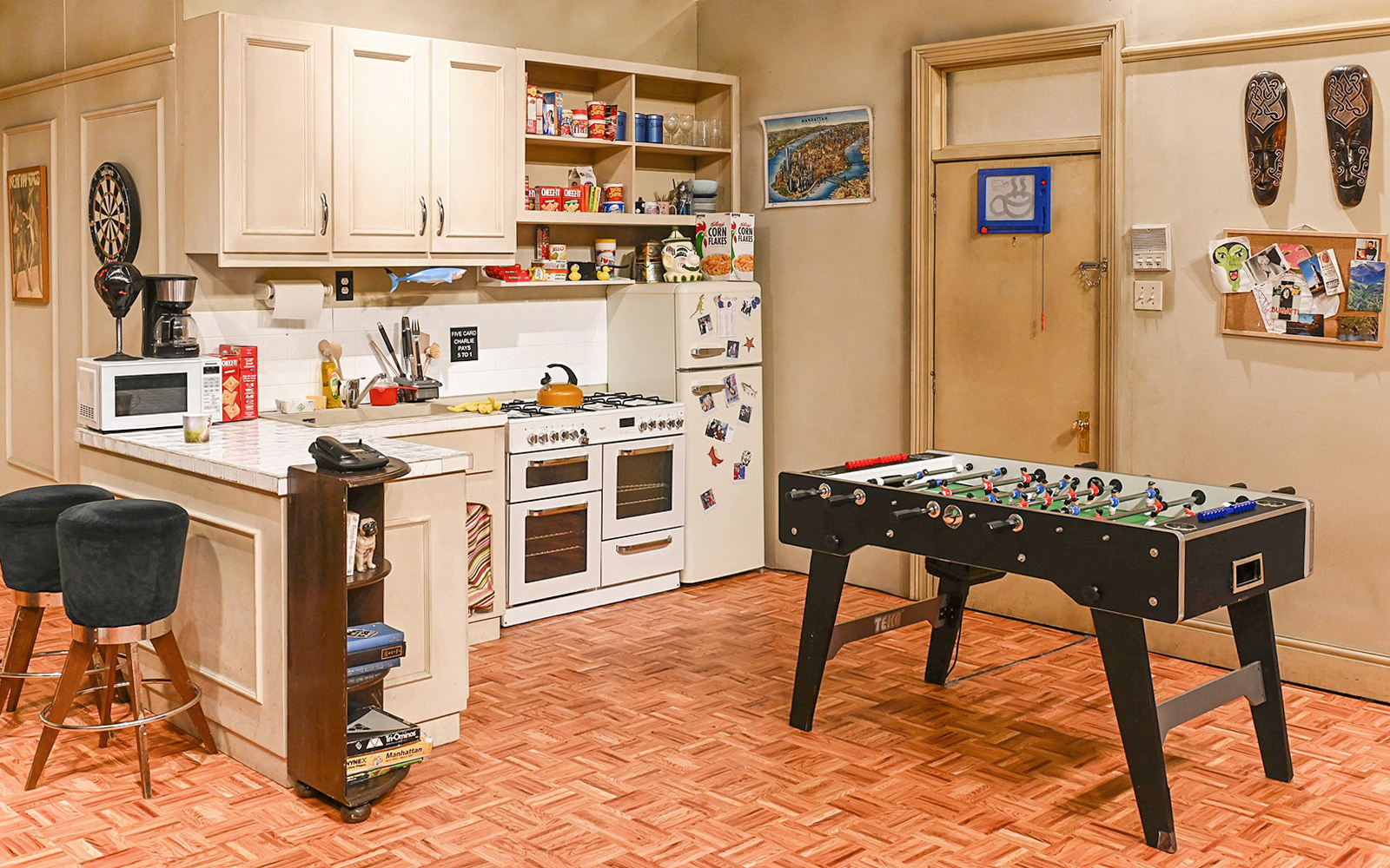 Kitchen set from The FRIENDS™ Experience with foosball table and vintage decor.