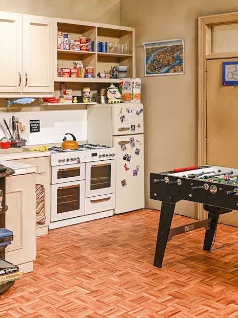 Kitchen set from The FRIENDS™ Experience with foosball table and vintage decor.