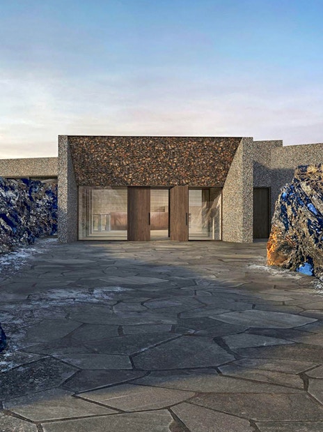 Myvatn Nature Baths entrance surrounded by rocky landscape in Iceland.