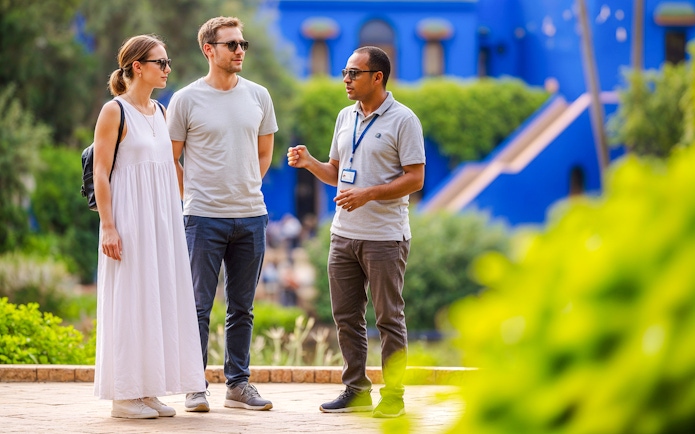 Guide explaining to visitors in Jardin Majorelle, Marrakech.