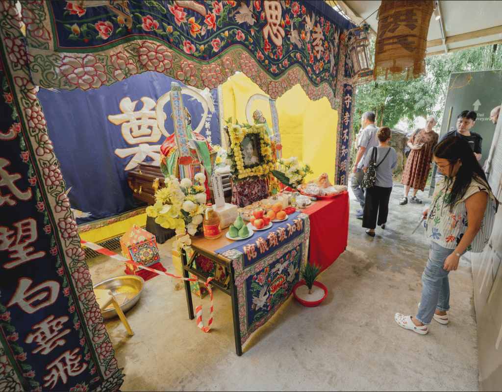 Traditional Chinese funeral display with offerings at Hell's Museum, Singapore.