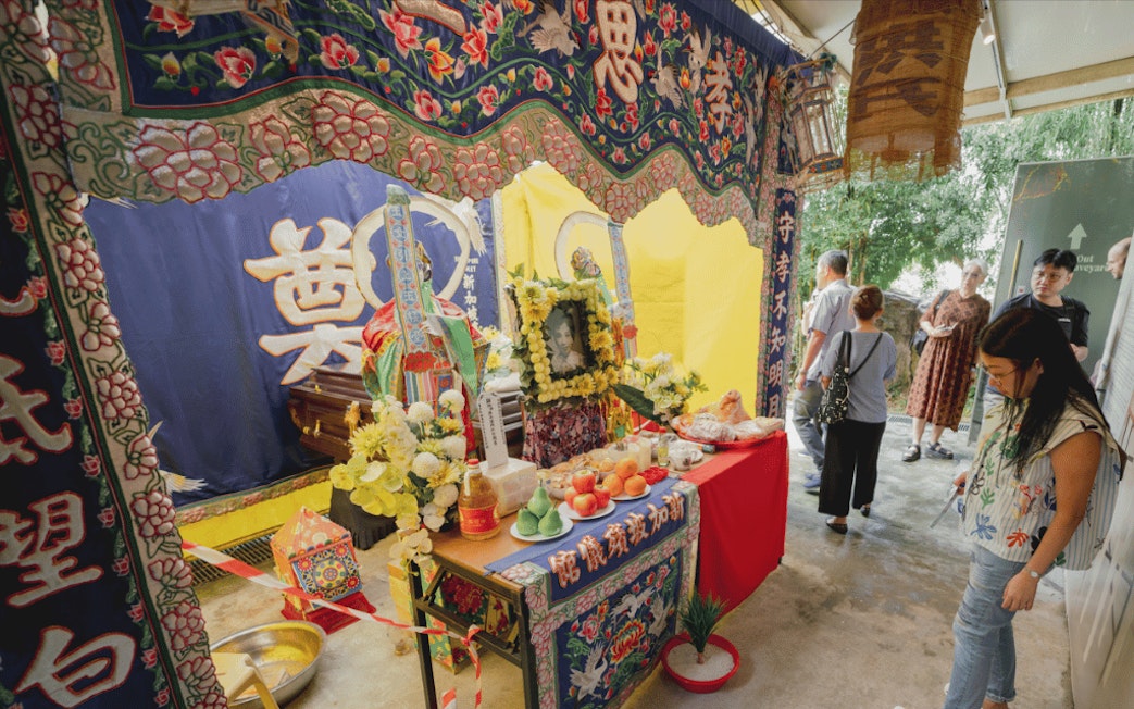 Traditional Chinese funeral display with offerings at Hell's Museum, Singapore.