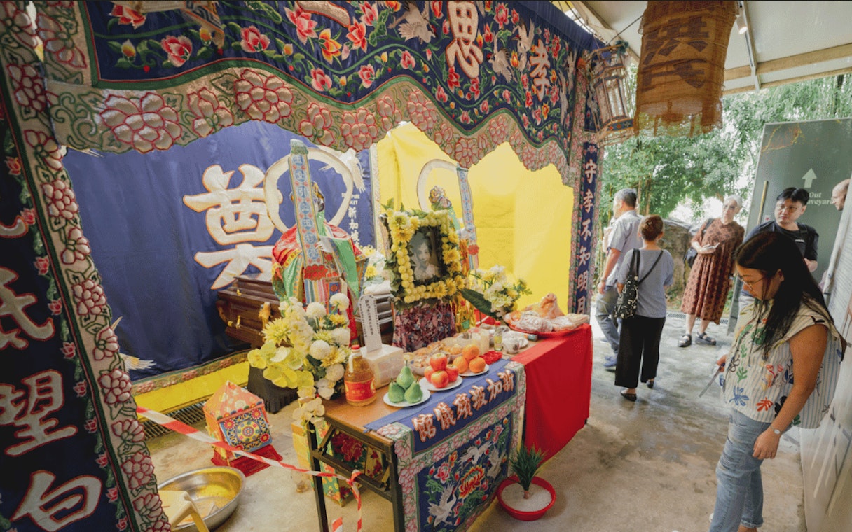 Traditional Chinese funeral display with offerings at Hell's Museum, Singapore.