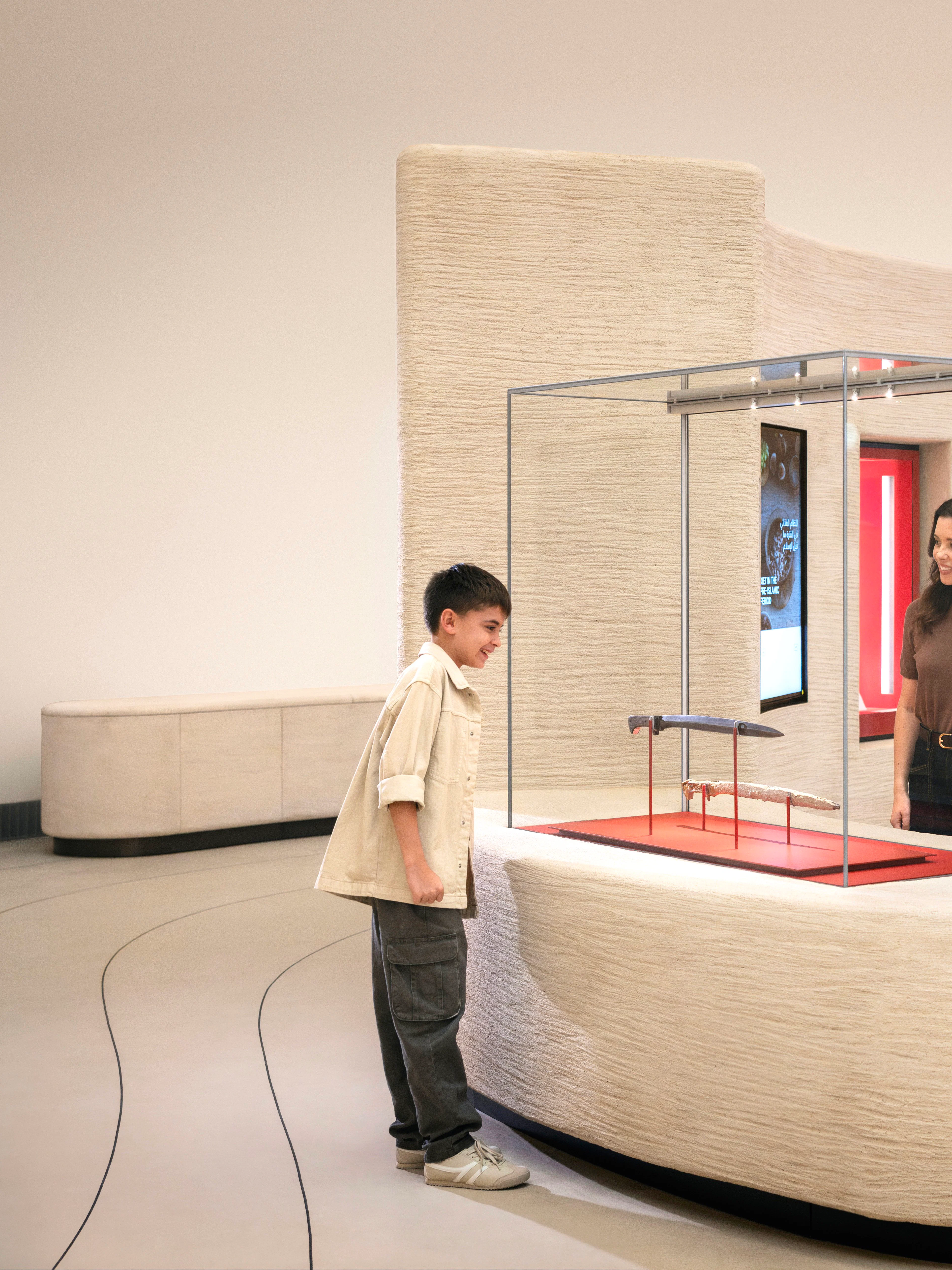Visitors exploring exhibits at Zayed National Museum, Abu Dhabi.