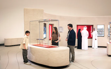 Visitors exploring exhibits at Zayed National Museum, Abu Dhabi.