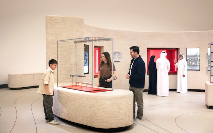 Visitors exploring exhibits at Zayed National Museum, Abu Dhabi.
