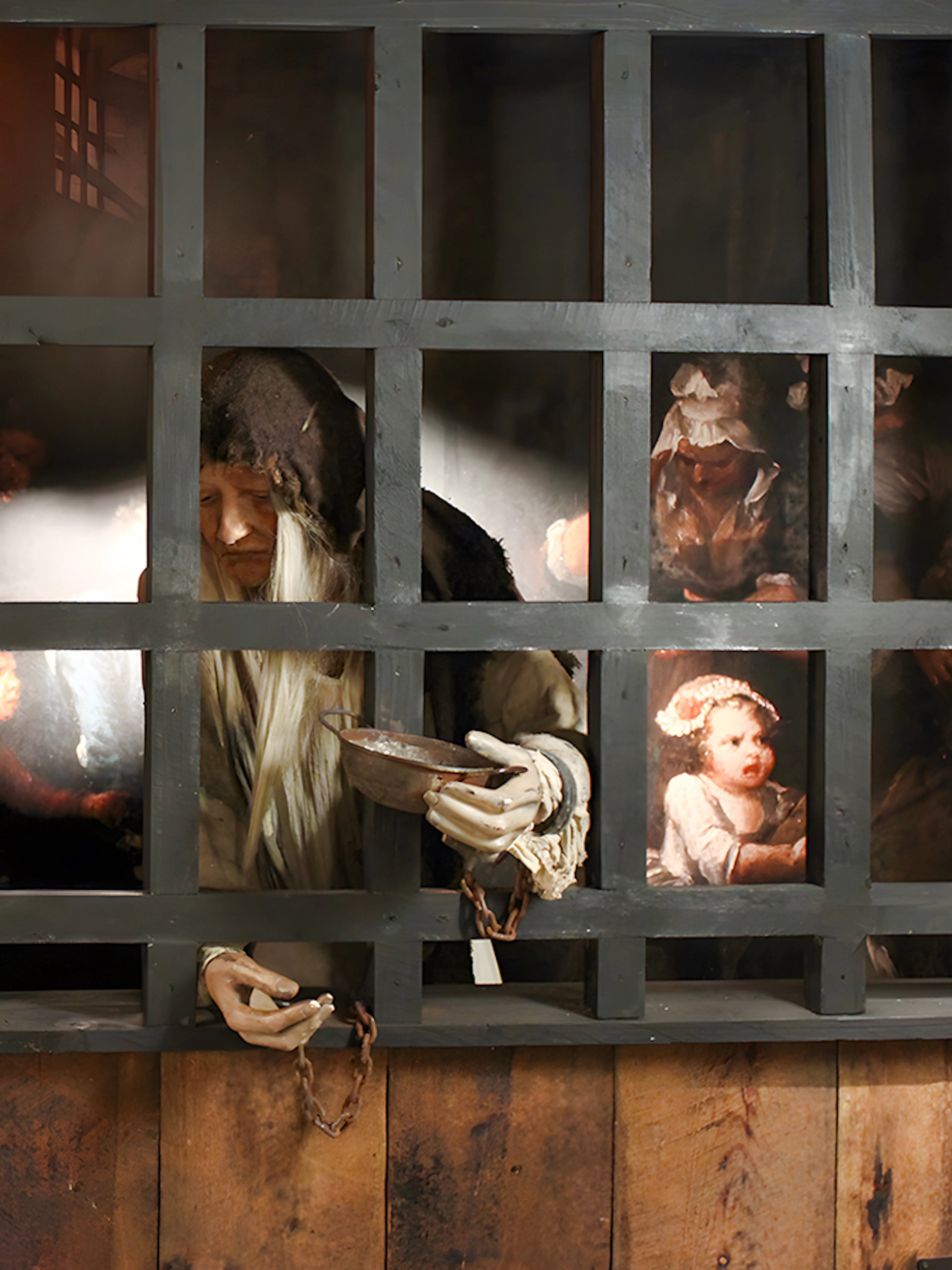 Prisoner mannequin behind bars at The Clink Prison Museum, London.