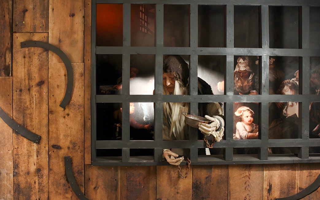 Prisoner mannequin behind bars at The Clink Prison Museum, London.